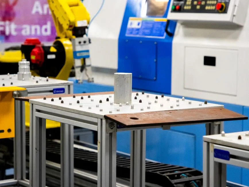 Close up of machinery in an industrial setting showcasing automation and technology.