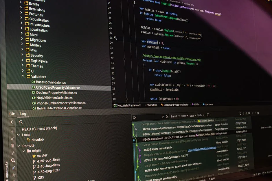 Close-up of software development tools displaying code and version control systems on a computer monitor.