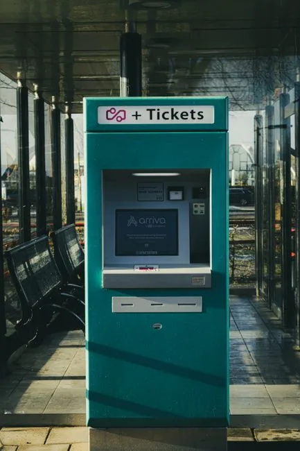 Ticket vending machine at Stavoren station in the Netherlands on a sunny day.